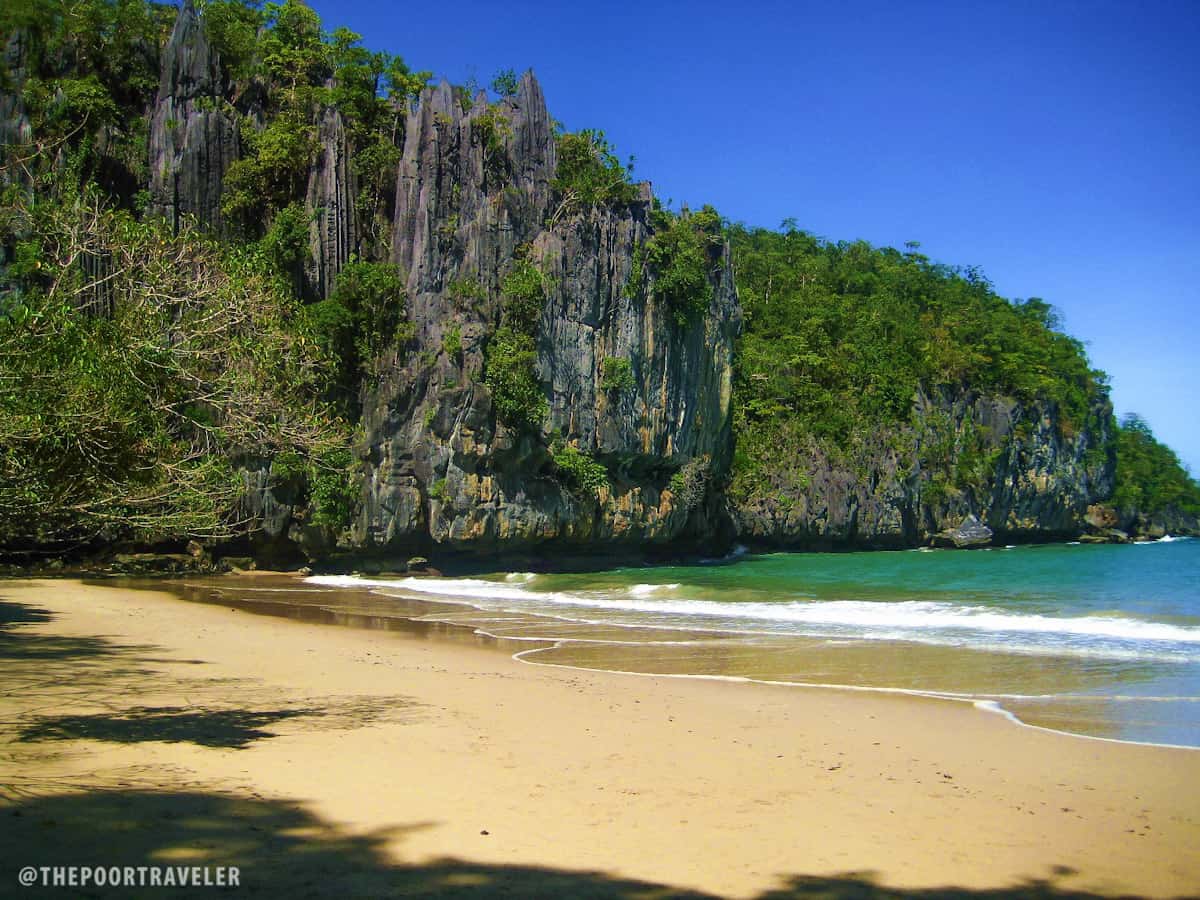 Limestone cliffs fronting the entrance.