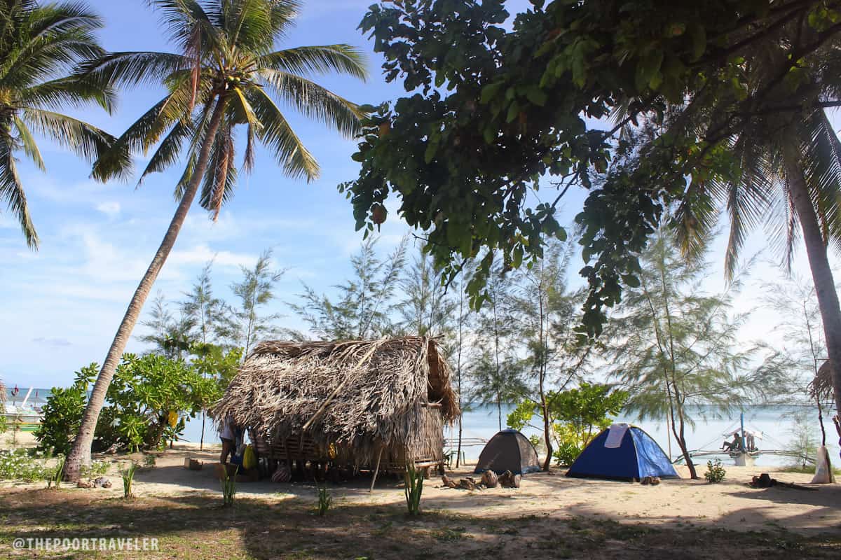 There are a few huts on the beach but most people bring their own tents.