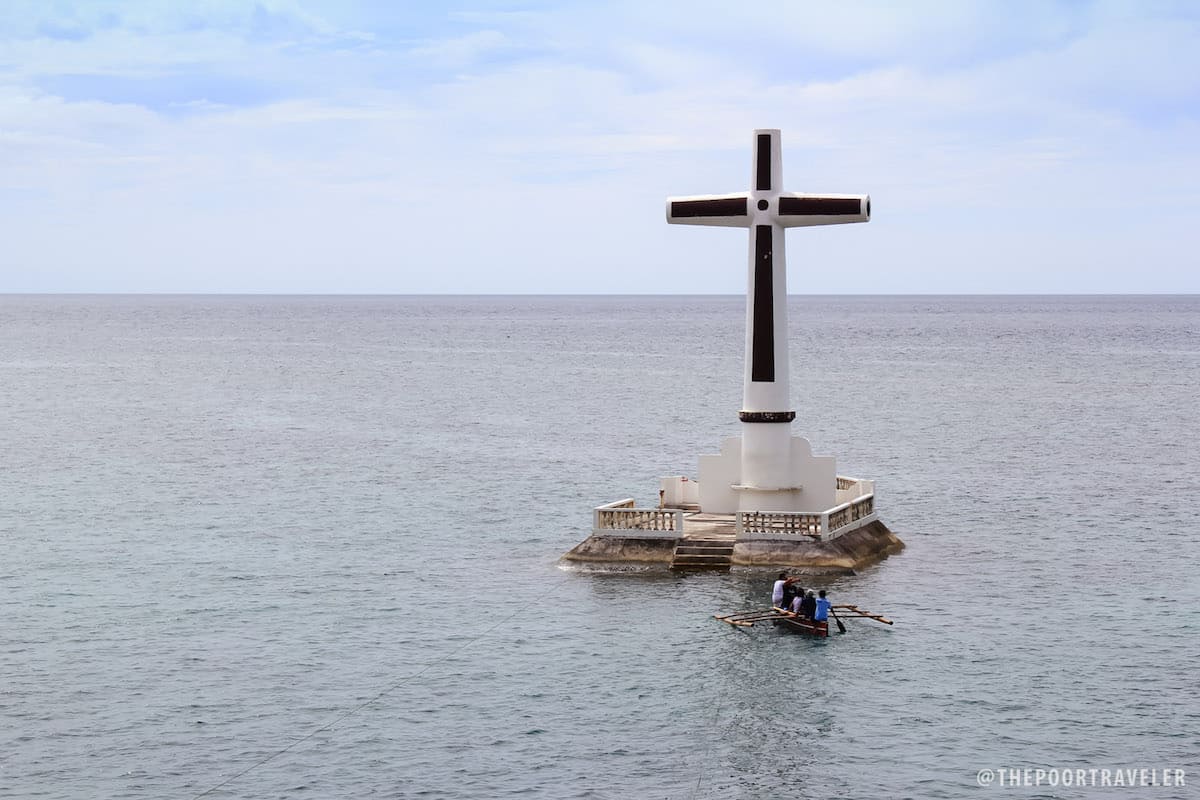 The cross that marks the spot where the cemetery used to be