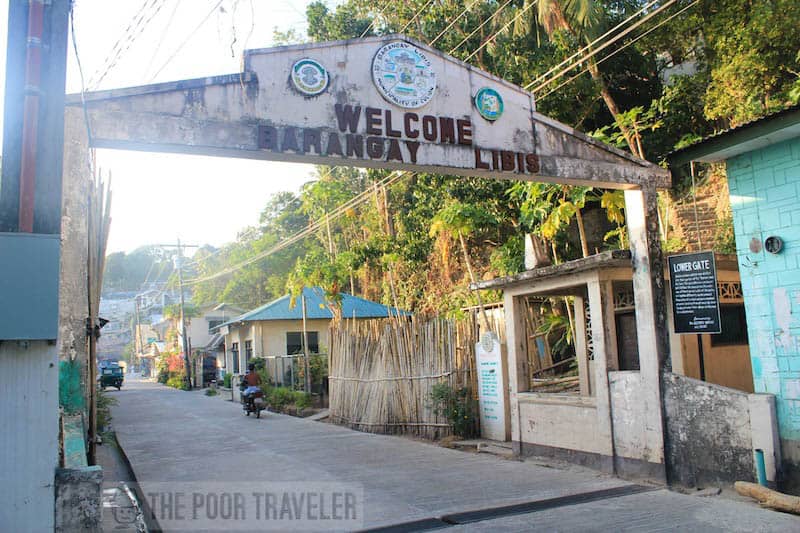 Lower gate. This barangay arc marker used to divide the town into two: the worlds of "leproso" and the "sano." All health workers passing through must dip hands in and wipe shoes with a disinfectant.