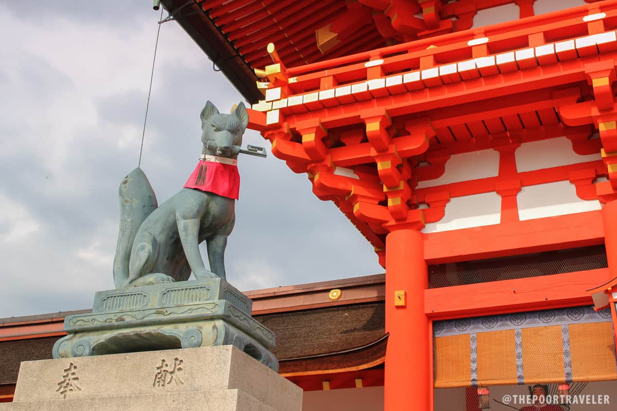 A fox with a key, guarding the Shrine