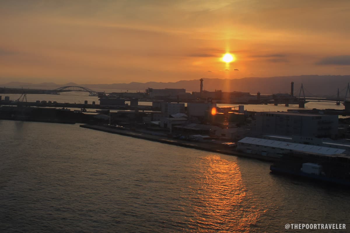 Osaka Bay Sunset. That's ___ in the distance