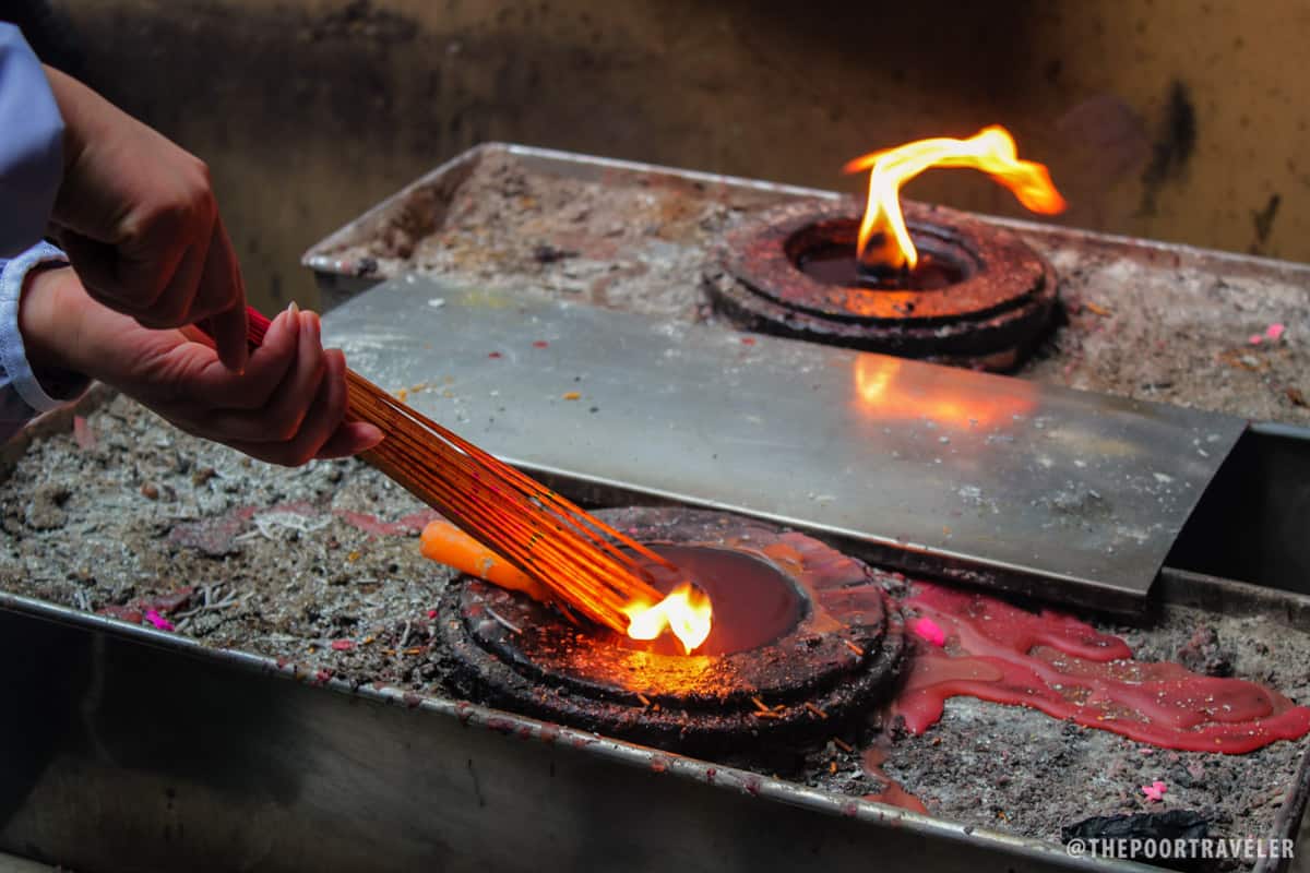 Most visitors come here to light joss sticks and say a prayer