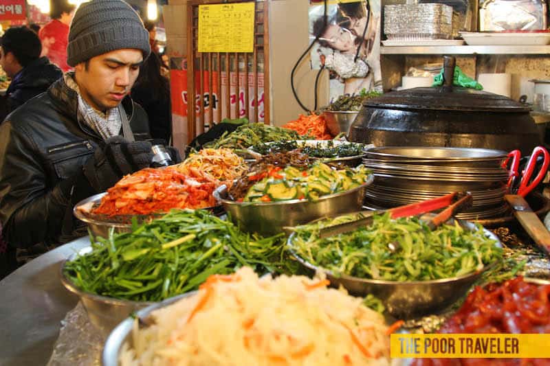 Bibimbap ingredients occupy most of the space. A serving costs KRW 3000.