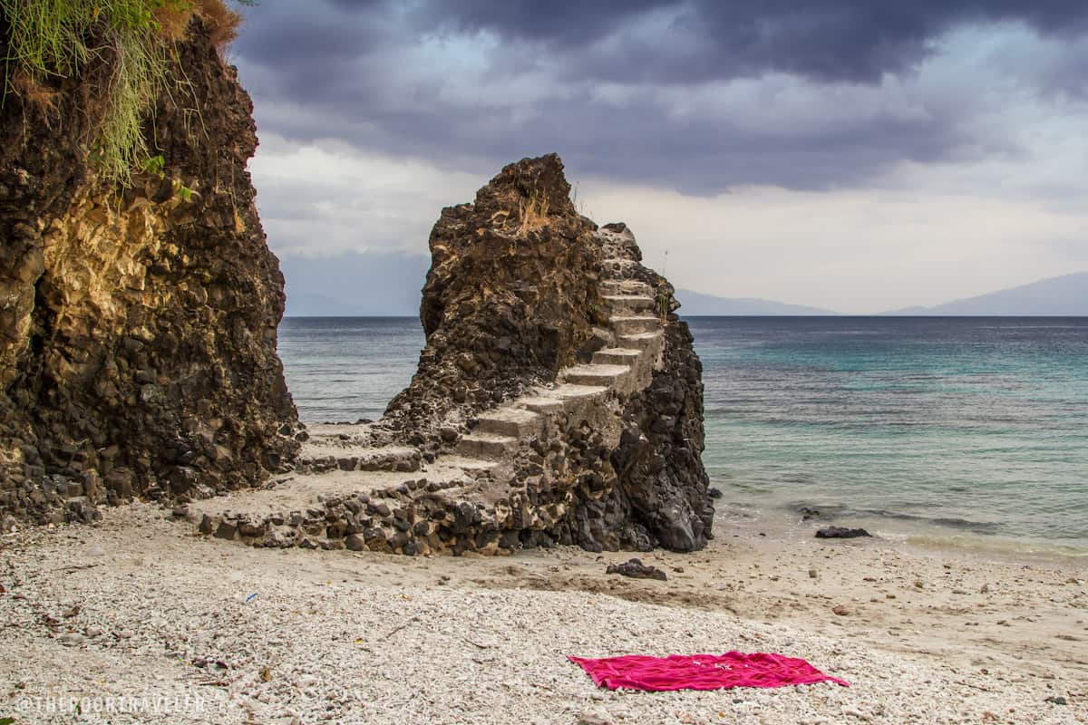 This staircase marks the beginning of the paved walkway to the other side of the beach.