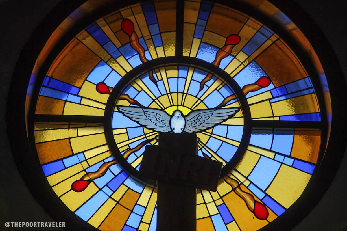 Stained glass behind the chapel's main crucifix