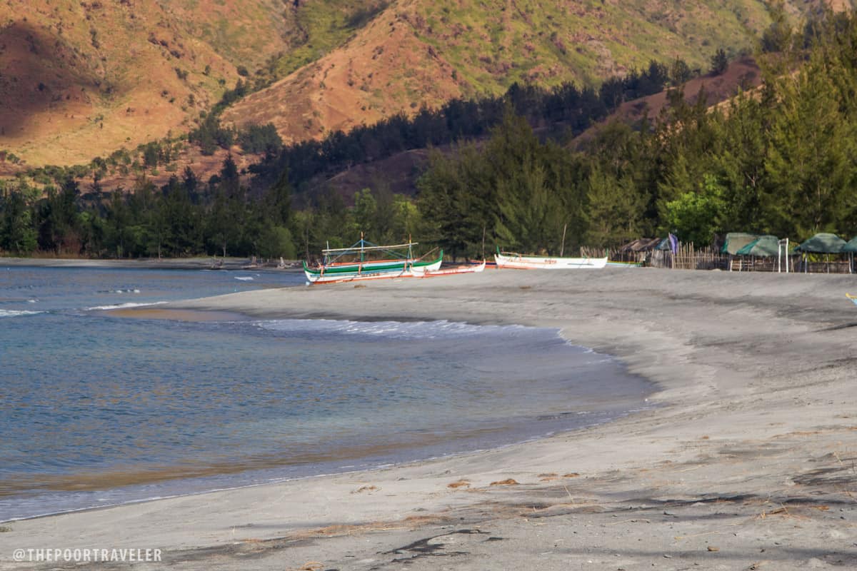 Silanguin's Beach is strewn with gray sand, not volcanic ash.