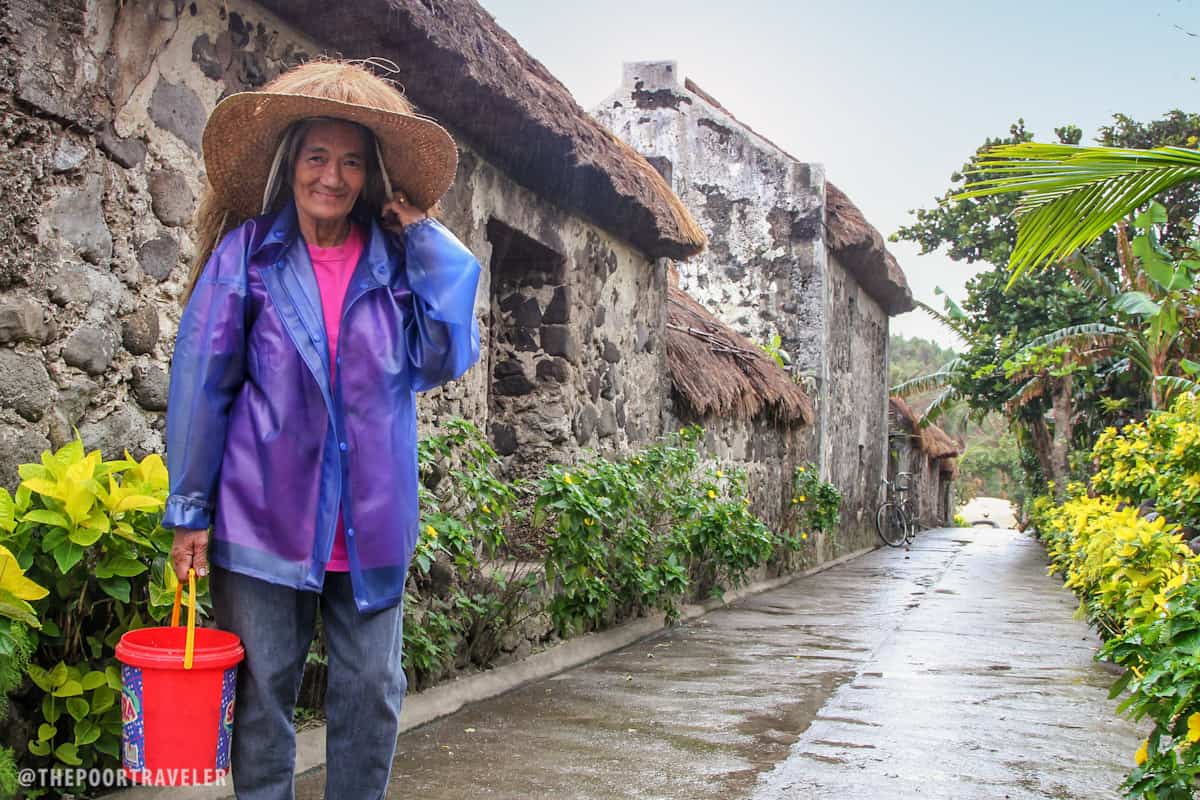 A local woman wearing vakul on top of a hat.