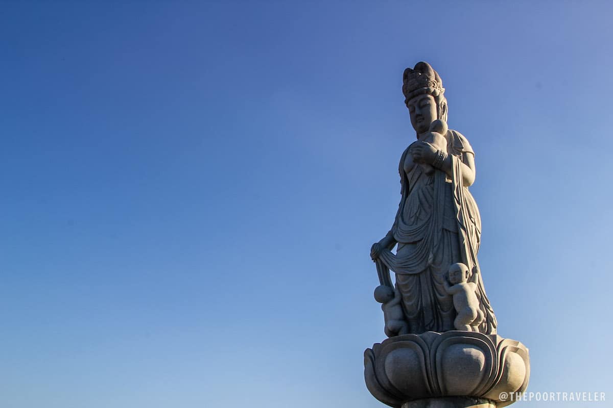 A fertility Buddha faces the direction of Japan.