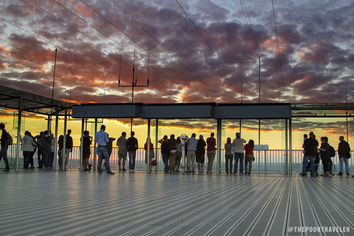 Tourists watching the sunset.