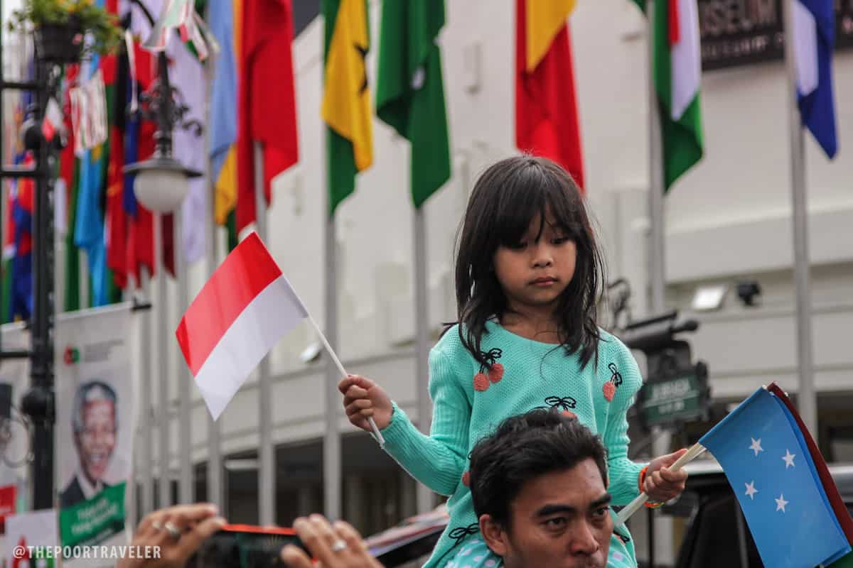 Waving national flags.