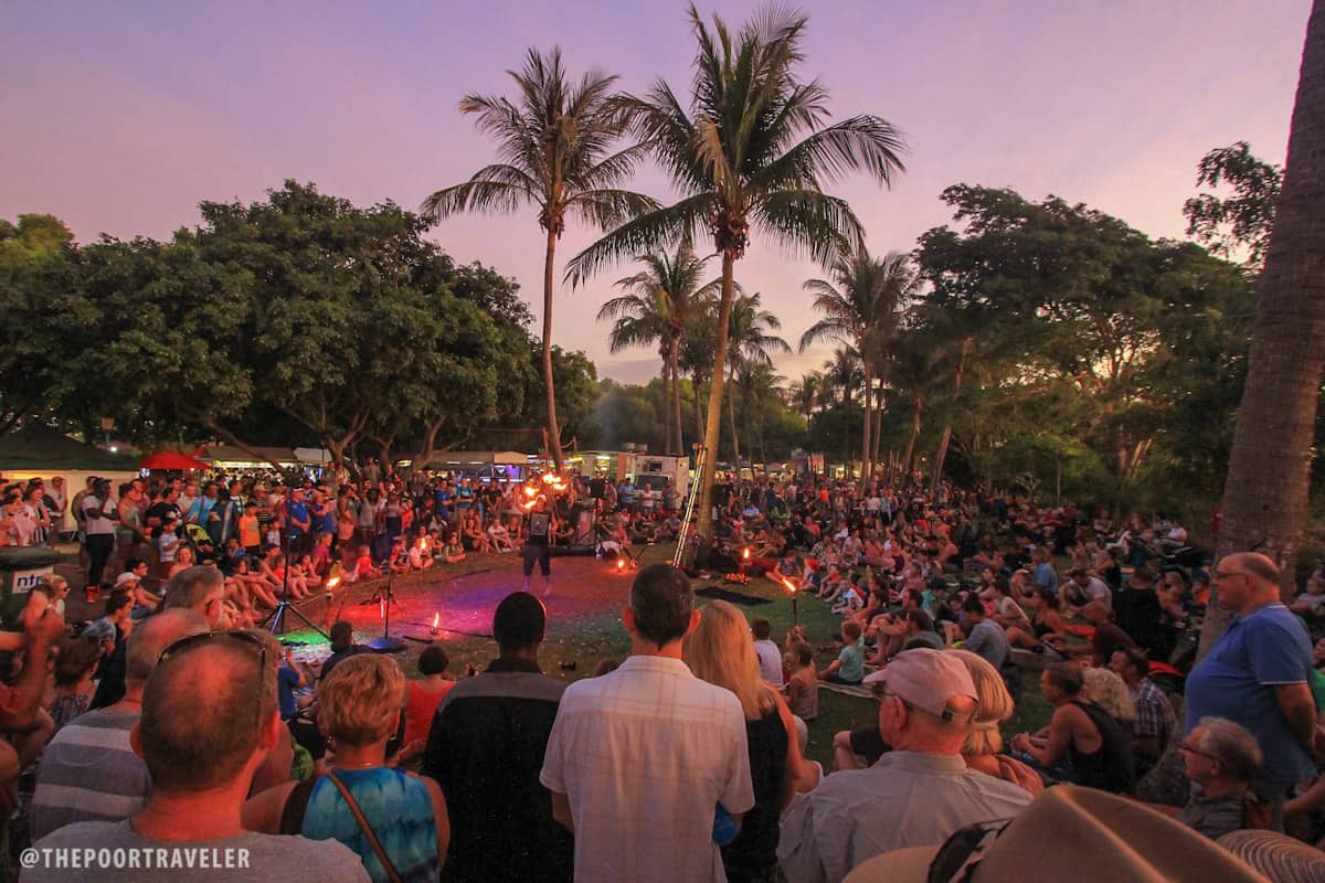 A man staging a fiery show for kids and kids-at-heart alike.