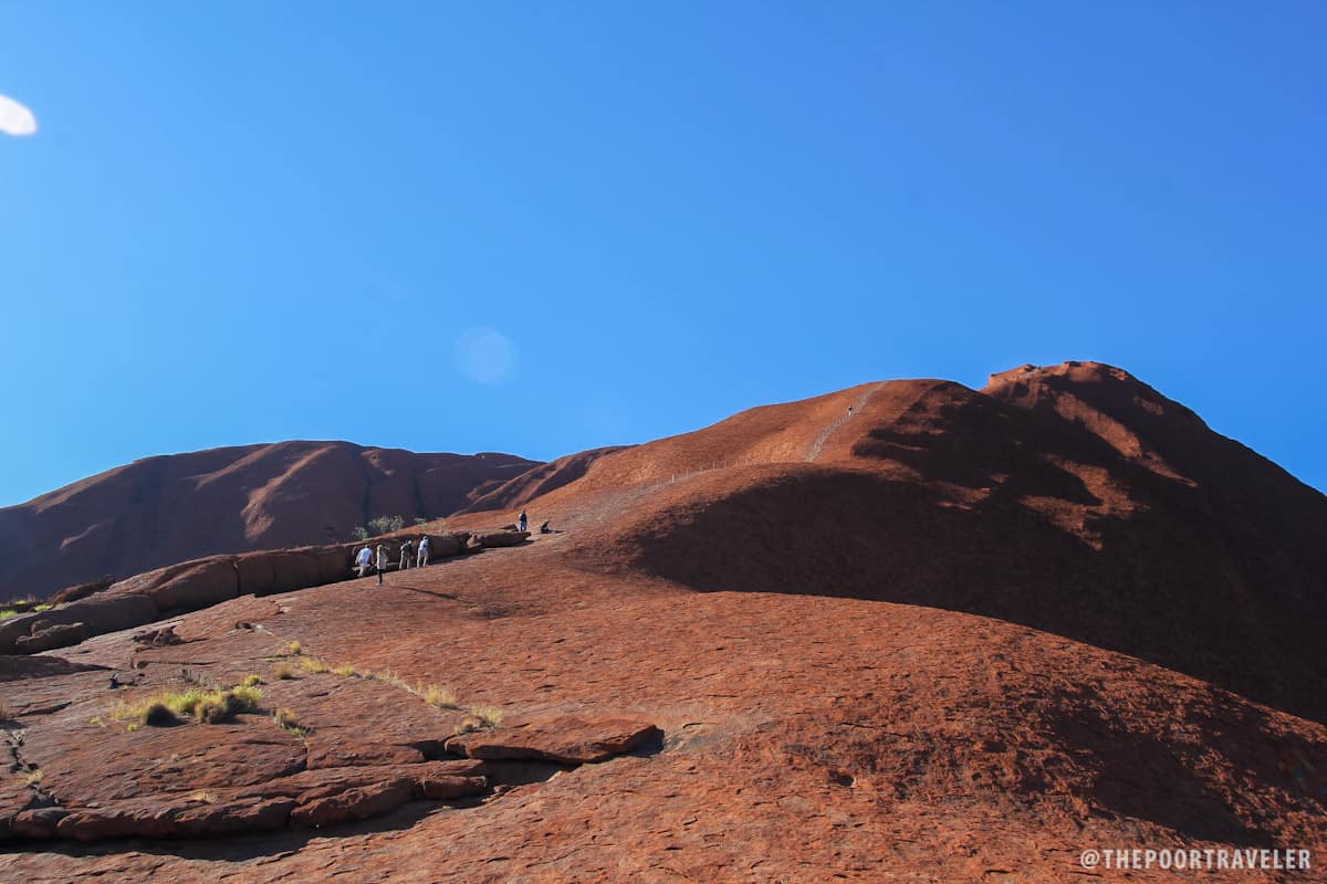 Some visitors still choose to climb Uluru despite warnings.