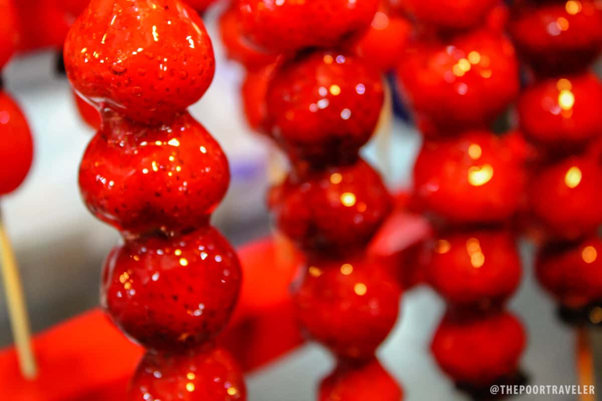 Candy-coated strawberries on a stick