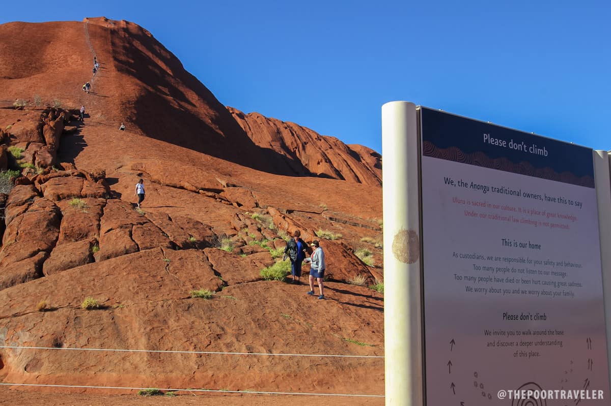 Some visitors still choose to climb Uluru despite warnings.