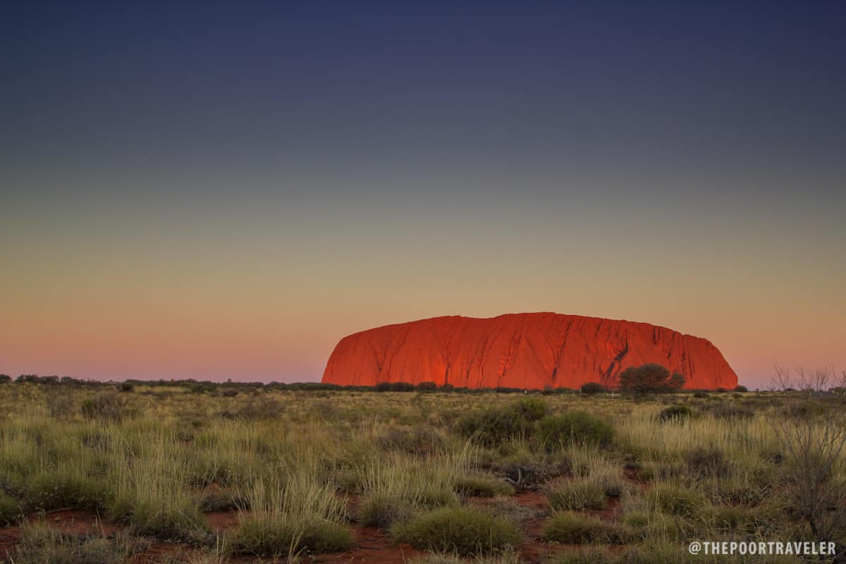 Uluru glows at sunset