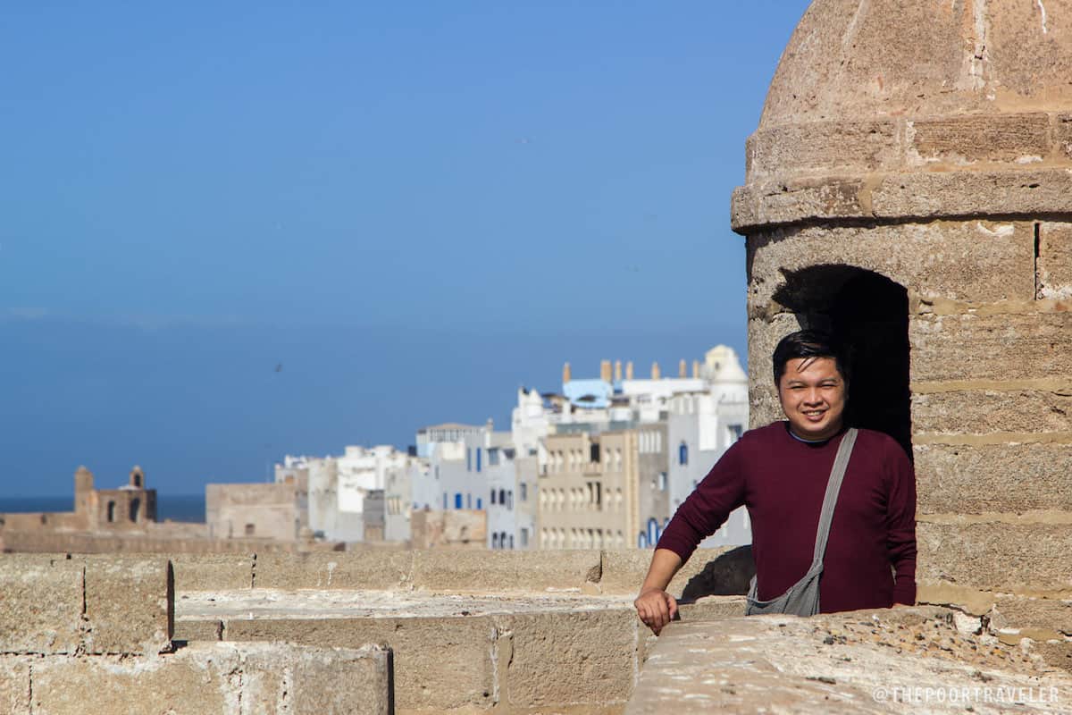 This is me hiding in one of the turrets atop Skala du Port. Walled medina in the background.